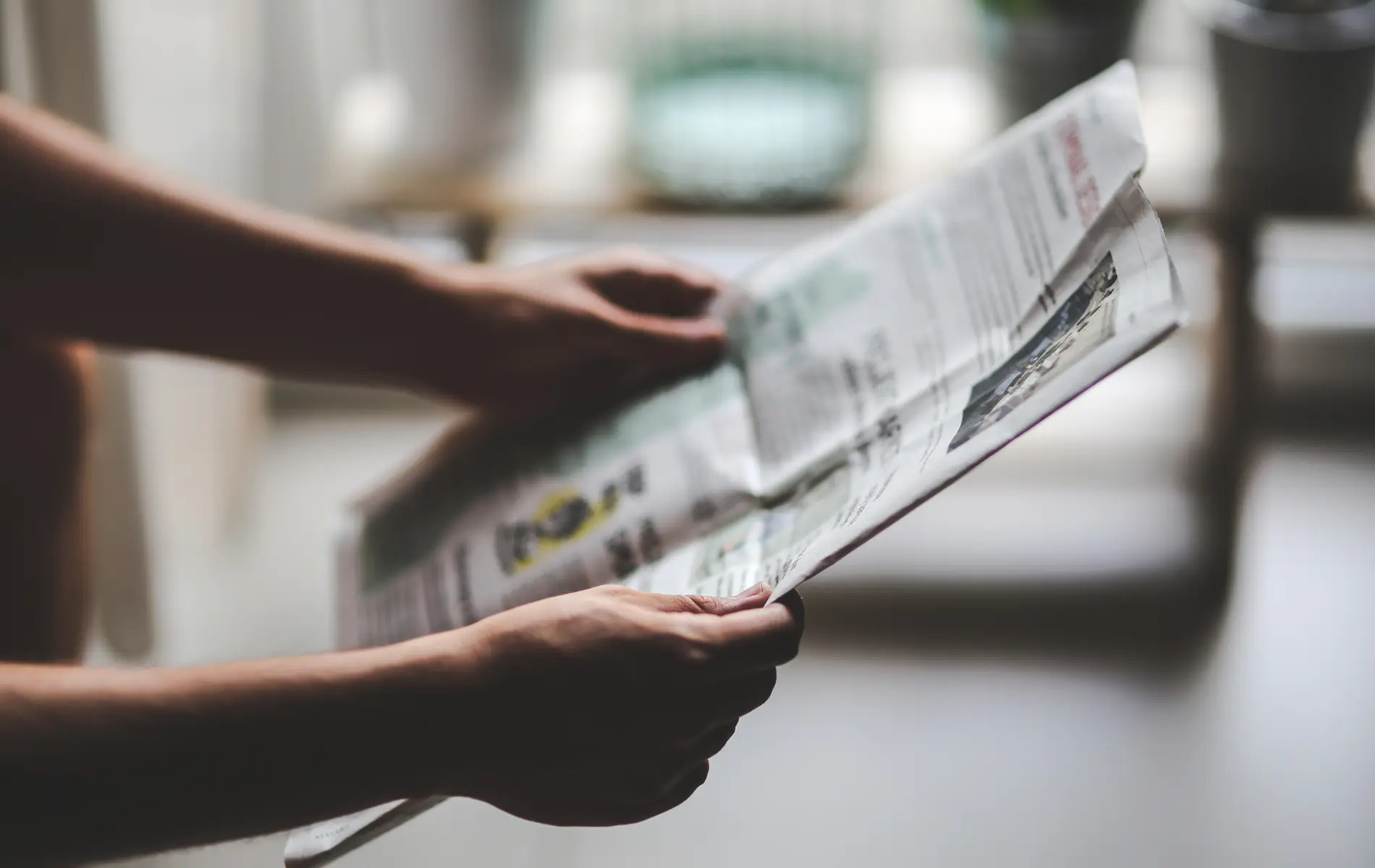 in the news reading a newspaper